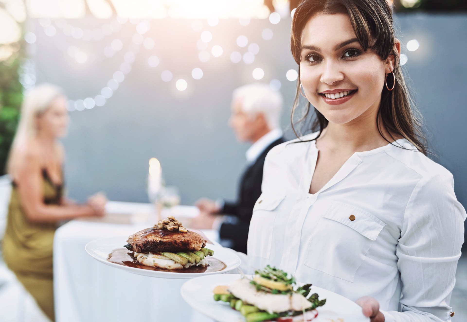 Woman, waitress and happy outside with food for customer service with pride and confidence for job opportunity. Female person, people and smile on portrait at restaurant for romance in hospitality